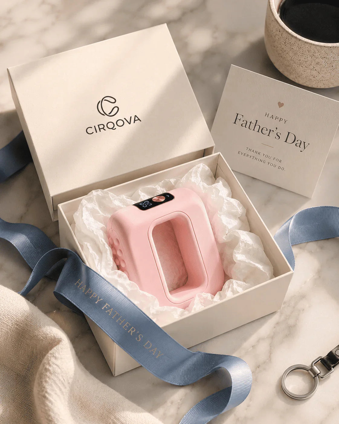 Pink hands-free massager in gift box with Father's Day ribbon and card